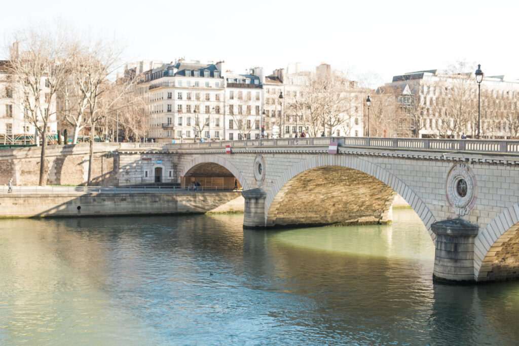 A photo of a bridge crossing the river Seine in Paris.