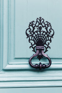 A close up photo of a door handle in Paris.