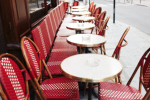 A photo of red tables on a terrace in Paris.