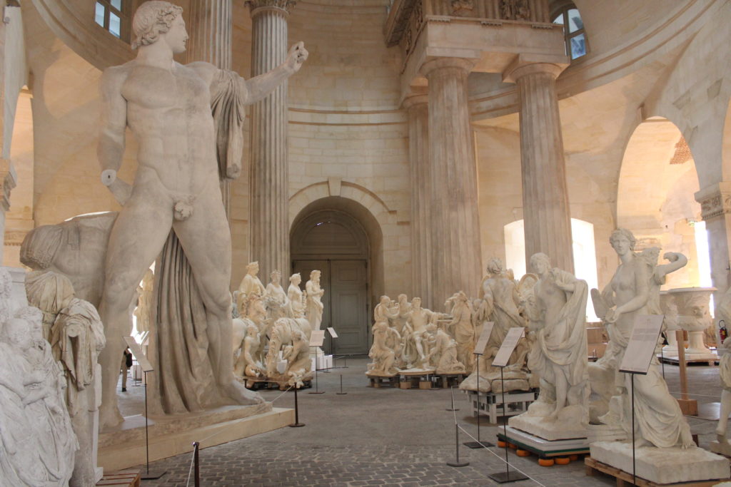 A photo of the Galerie des Sculptures et des Moulages showing the scale and height of some of the statues.
