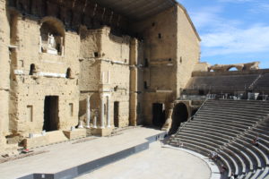 A photo of the Roman Theatre of Orange. The stage is on the left and the seats can be seen on the left.