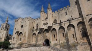 A photo of the exterior of the Avignon Papal Palace.