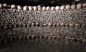 A photo of the stacks of skulls in the Paris catacombs in the 14e arrondissement of Paris.