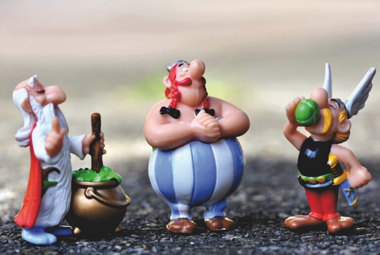 A photo of the characters from the Astérix comic strip, who form the theming of Parc Astérix. The three characters are plastic characters in a line depicting Asterix, Obelix, and Panoramix.
